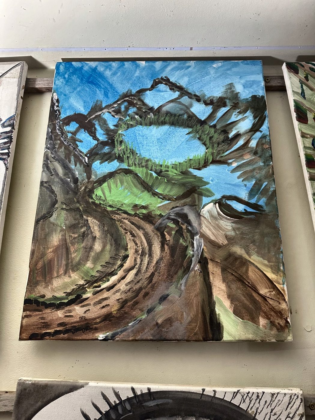 Acrylic painting of a tree bridging a canyon under a blue sky
